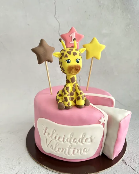 Tarta rosa de jirafa con el 1